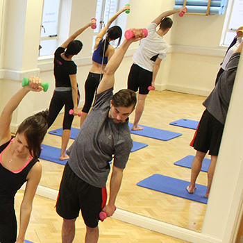 Lady stretching whilst using resistance bands