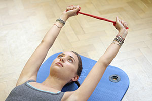 client using streching pilates tool